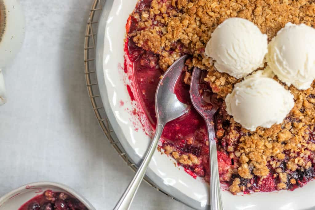Quick and Easy Berry Crisp topped with a oat crumble